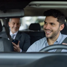 Man driving a passenger in their taxi