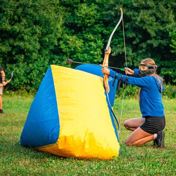 Someone Playing Archery Tag Whilst Behind Cover