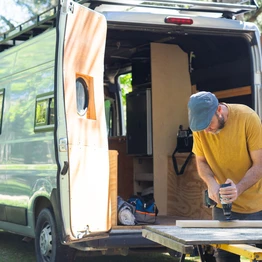 A Man Converting A Campervan