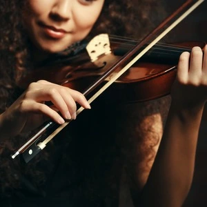 A student playing their musical instrument