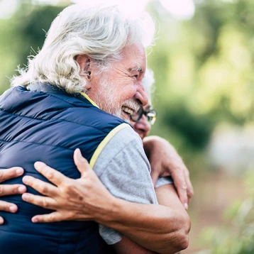 An Older Couple Hugging