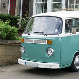 A Classic Campervan Parked On A Driveway