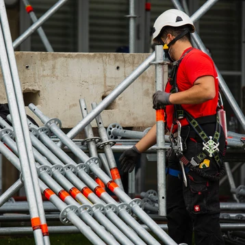 Scaffolder Picking Up Scaffolding